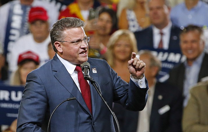 Arizona GOP chairman Robert Graham speaks prior to Republican presidential candidate Donald Trump at a rally in Phoenix. Party chairman Graham has already removed one of the state’s 58 delegates because she refused to vote for Donald Trump on the first ballot. 
