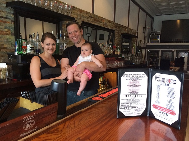 Bethany and Mark Walters with their baby Skylar Rose in their new bar, Prescott Public House. 