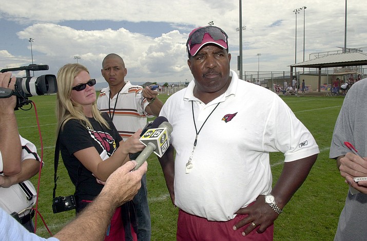 In this Aug. 6, 2005, file photo, former Arizona Cardinals head coach Dennis Green talks to the media after a no-pads scrimmage during training camp at Pioneer Park in Prescott. Green died of a heart attack Friday. He was 67.