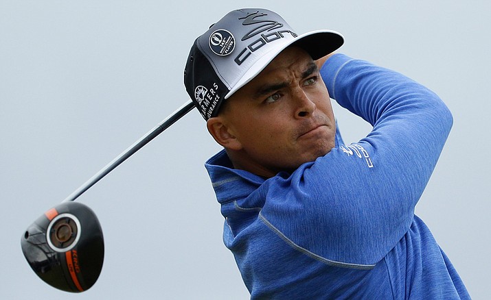 In this July 16 file photo, Rickie Fowler hits his tee shot on the seventh hole during the third round of the British Open.