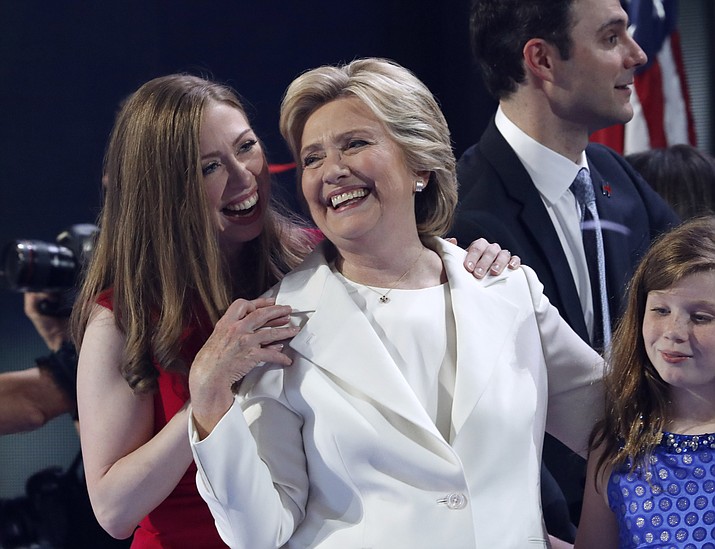 Chelsea Clinton shares a moment on stage with her mother Democratic presidential nominee Hillary Clinton during the final day of the Democratic National Convention in Philadelphia , Thursday, July 28, 2016.