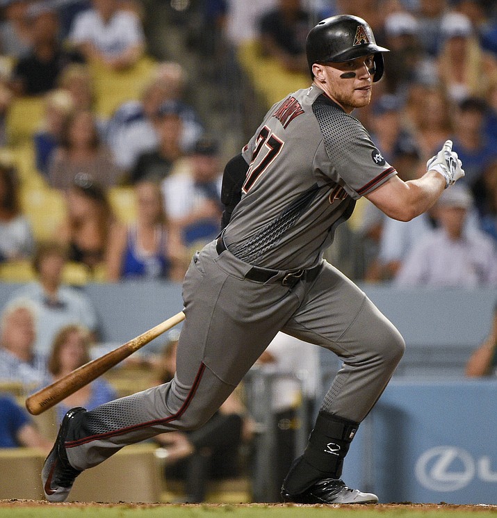 Arizona Diamondbacks' Brandon Drury follows through on an RBI single during the seventh inning of a baseball game against the Los Angeles Dodgers in Los Angeles, Saturday, July 30, 2016.