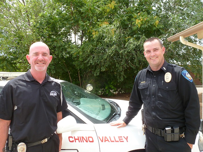 Police officers Gary Bruso (left) and Lt. Vince Schaan of the Chino Valley police department.