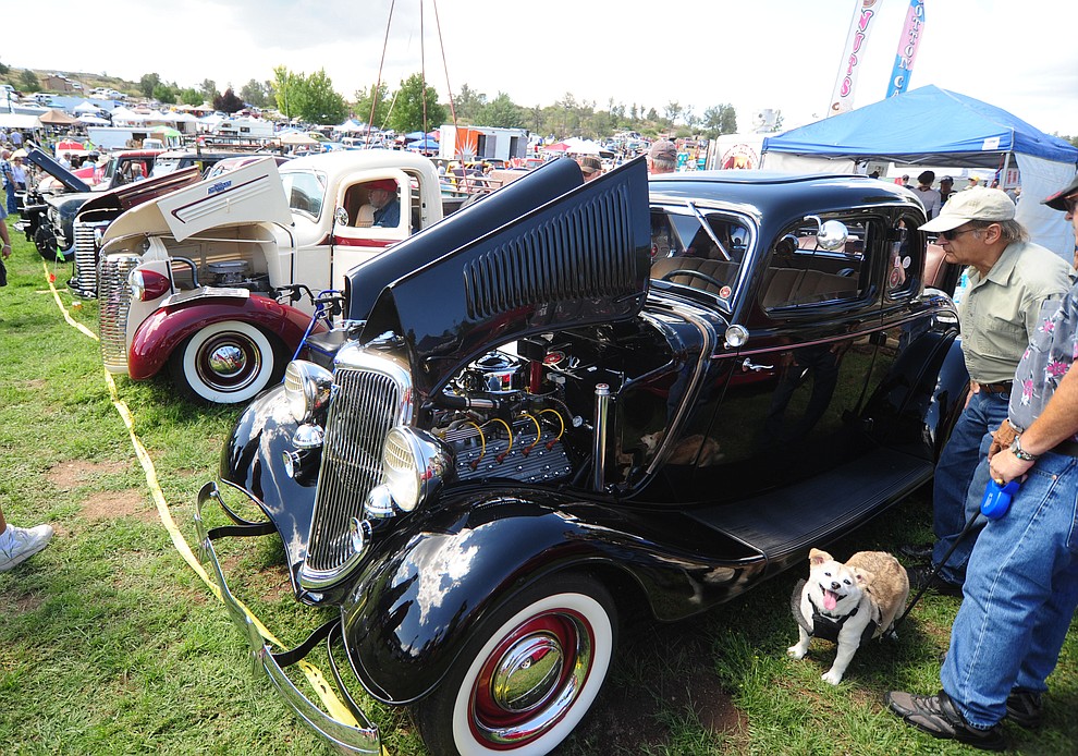 People get an upclose look at the hundreds of cars, trucks, and parts vendors at the 42nd Annual Prescott Antique Auto Club show at Watson Lake Park Saturday. The show continues all day on Sunday.  (Les Stukenberg/The Daily Courier)