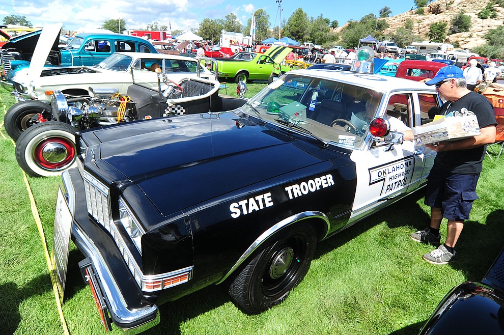 A restored Oklahome State Trooper car was one of hundreds of cars, trucks, and parts vendors at the 42nd Annual Prescott Antique Auto Club show at Watson Lake Park Saturday. The show continues all day on Sunday.  (Les Stukenberg/The Daily Courier)