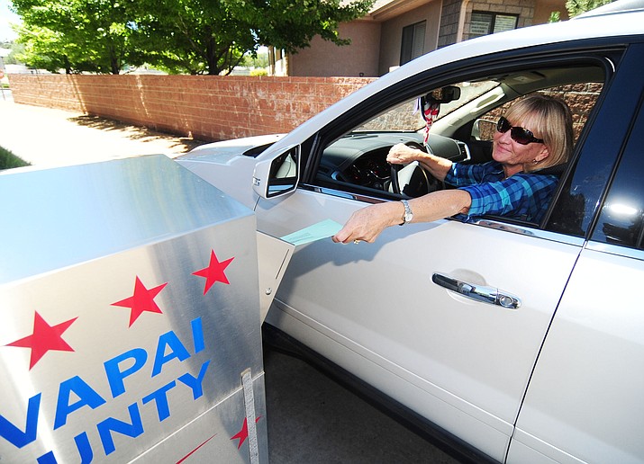 Nancy Stamile drops off her primary election ballot at the Yavapai County Administration Building Monday, August 29, 2016. (Les Stukenberg/The Daily Courier)