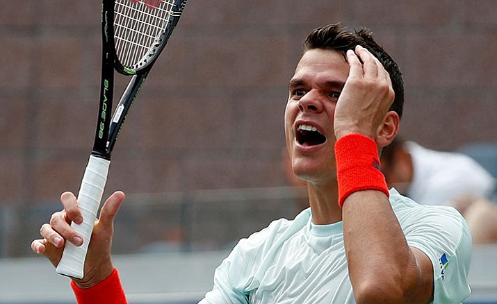 Milos Raonic reacts after a point to Ryan Harrison during the second round of the U.S. Open.