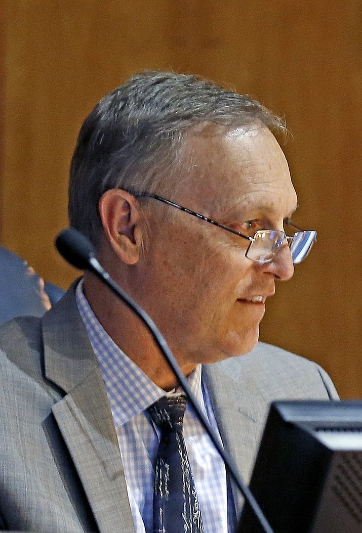 In this May 3, 2016, file photo, Arizona state Sen. Andy Biggs sits in session in the Senate during budget deliberations at the Arizona Capitol in Phoenix. Biggs is in a close primary race to replace retiring Republican Rep. Matt Salmon in the 5th District, with Christine Jones leading Biggs by fewer than 900 votes, with other candidates further behind. 