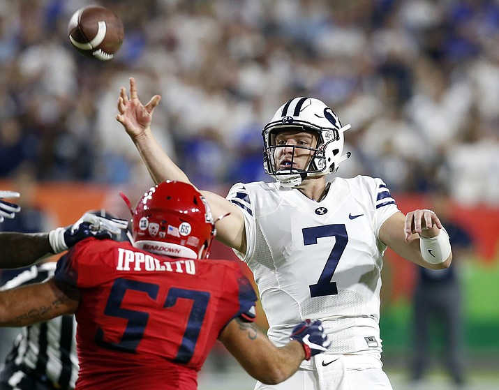 BYU quarterback Taysom Hill (7) throws during the first half against Arizona in an NCAA college football game, Saturday, Sept. 3, 2016, in Phoenix.