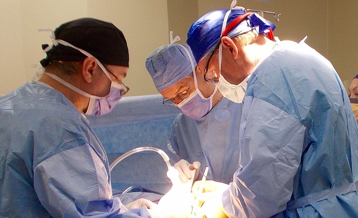 Dr. Bertrand Kaper, right, performs surgery in Guatemala, as part of his charity - “Operation Walk Arizona.”
