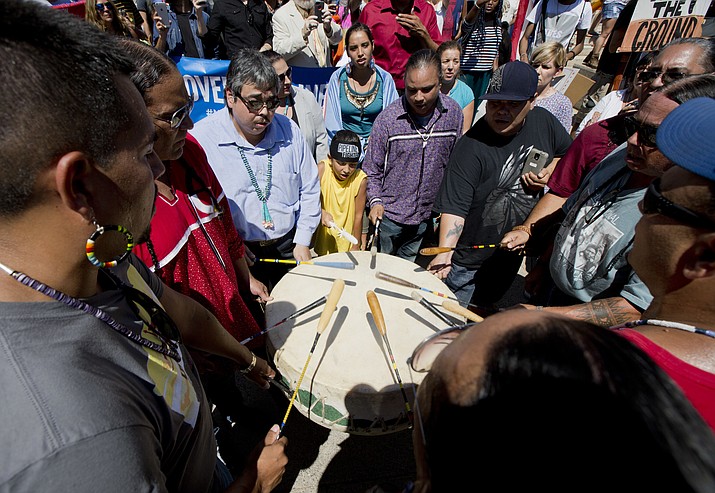 Native Americans from different tribes play a drum during a rally outside U.S. District Court in Washington, Wednesday, Aug. 24, in solidarity with the Standing Rock Sioux Tribe in their lawsuit against the Army Corps of Engineers.