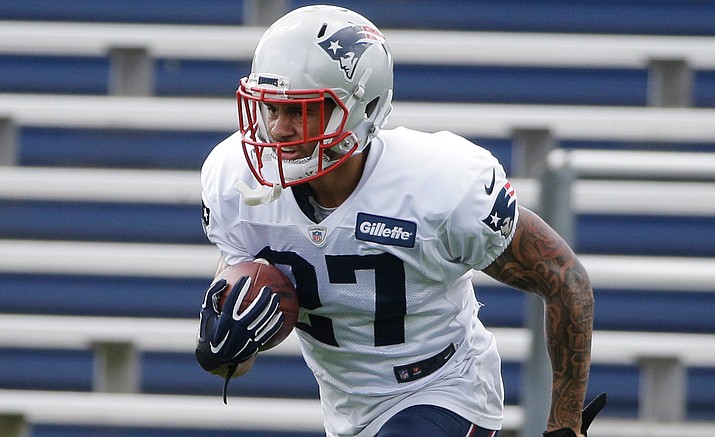 New England Patriots’ D.J. Foster carries the ball during practice Wednesday in Foxborough, Mass. Foster, a former Arizona State Sun Devils football standout, made the 53-man roster as an undrafted rookie free agent.