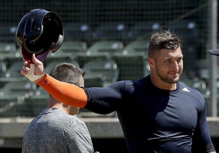 In this Aug. 30, file photo, former NFL quarterback Tim Tebow finishes his work out for baseball scouts and the media in Los Angeles. Tebow has signed a minor league contract with the New York Mets. The Mets announced Thursday, Sept. 8,  that the former quarterback will take part in the Instructional League in Port St. Lucie, Florida.