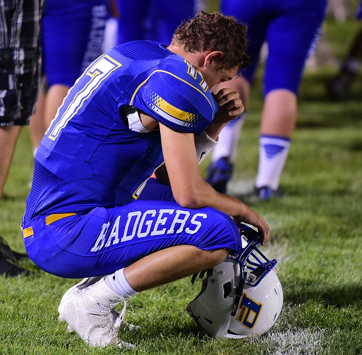 Prescott's starting quarterback Ryan Greene on the sidelines as the Badgers take on Cactus Shadows Friday night in Prescott. (Les Stukenberg/The Daily Courier)