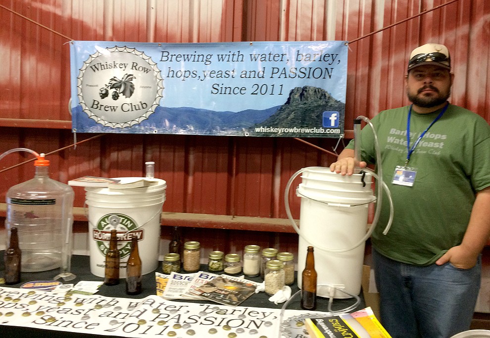 John Allen, events coordinator with the Whiskey Row Brew Club, stands near an exhibit at the Yavapai County Fair. No tasting is available, but people can learn about brewing and the club, which meets on the third Thursday of the month at the Prescott Brewing Company.