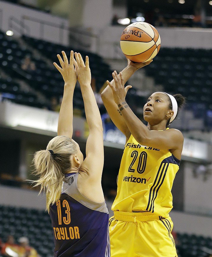 Indiana Fever’s Briann January (20) shoots over Phoenix Mercury’s Penny Taylor (13) during the first half of a first round WNBA  playoff basketball game Wednesday, Sept. 21, 2016, in Indianapolis. 
