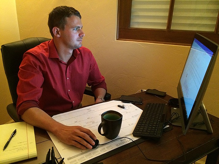 Nick Hanlon, owner of Prescott ARM, works at his computer in his downtown Prescott office. 
