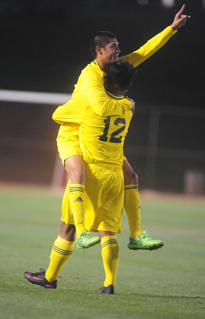 Yavapai's Alfredo Figueroa (12) congratulates Isaac Arellano (21) on his first half goal as the Roughriders take on Glendale Community College Tuesday, September 27, 2016 at Mountain Valley Park in Prescott Valley.(Les Stukenberg/The Daily Courier)