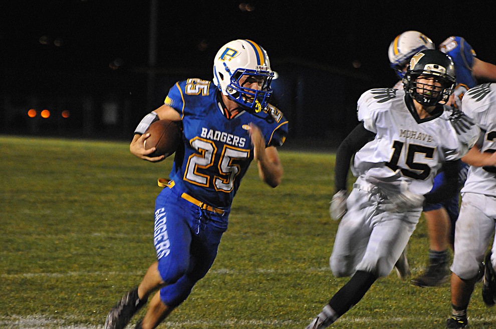 A.J. McCracken (25) sprints down the sideline for a 36-yard touchdown run, giving the Badgers a 16-0 lead in the first quarter Friday, Sept. 30, at homecoming. Prescott (4-2, 2-0 4A Grand Canyon) earned a 43-14 win over Mohave. (Brian M. Bergner Jr./The Daily Courier)