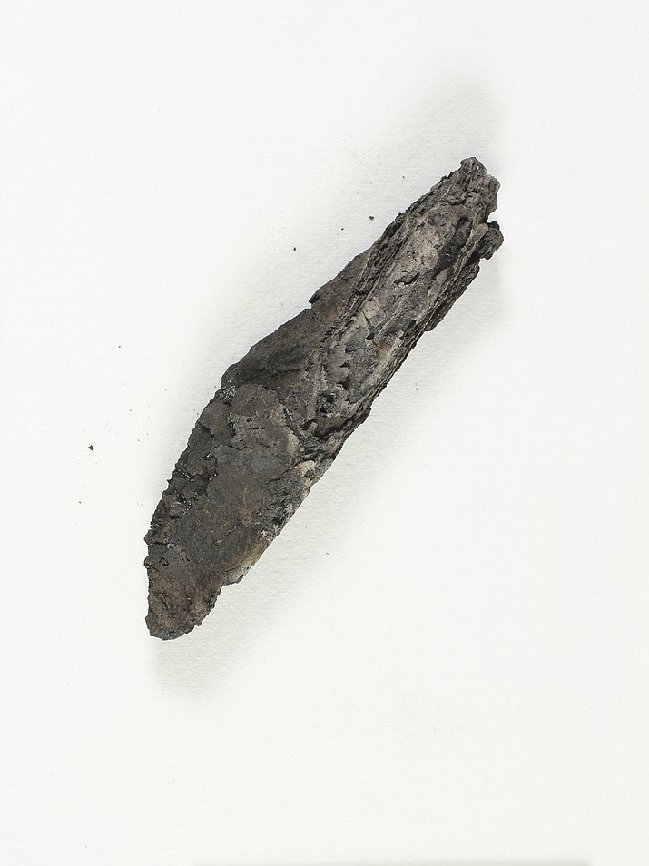 This undated photo released by the Israel Antiquities Authority shows an ancient charred scroll destroyed in a fire centuries ago. The 3D analysis is the first time experts say they have been able to read the text of an ancient scroll without having to physically open it. 