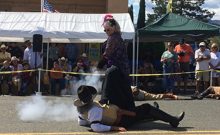 One of the Shady Ladies shoots a Prescott Regulator during a shootout at the 109th Annual Agua Fria Festival.
