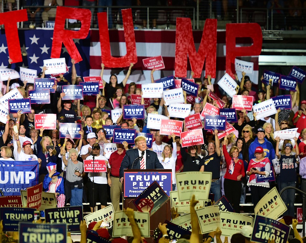 Supporters cheer as Donald Trump speaks at the Trump for President Rally in the Prescott Valley Event Center Tuesday, October 4, 2016. (Les Stukenberg/The Daily Courier)