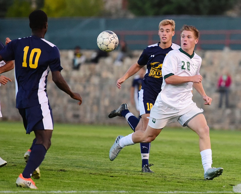 Yavapai's Mathew Jordan (28) tries to break free as the Roughriders host Phoenix College in a soccer matchup Thursday, October 6, 2017 in Prescott. (Les Stukenberg/The Daily Courier Photo)