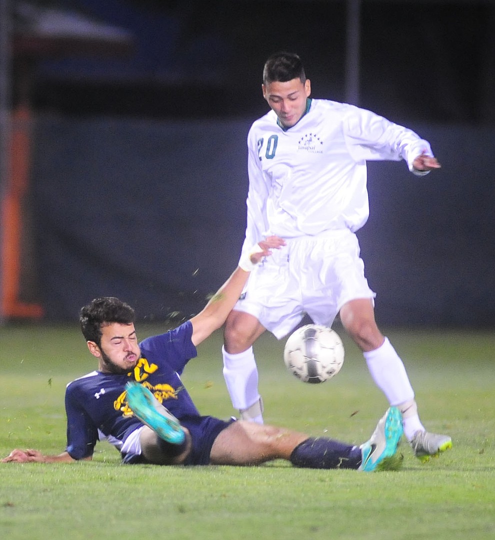 Yavapai's Santos Villasenor (20) takes the ball away from Christian Hurtado (22) as the Roughriders host Phoenix College in a soccer matchup Thursday, October 6, 2017 in Prescott. (Les Stukenberg/The Daily Courier Photo)