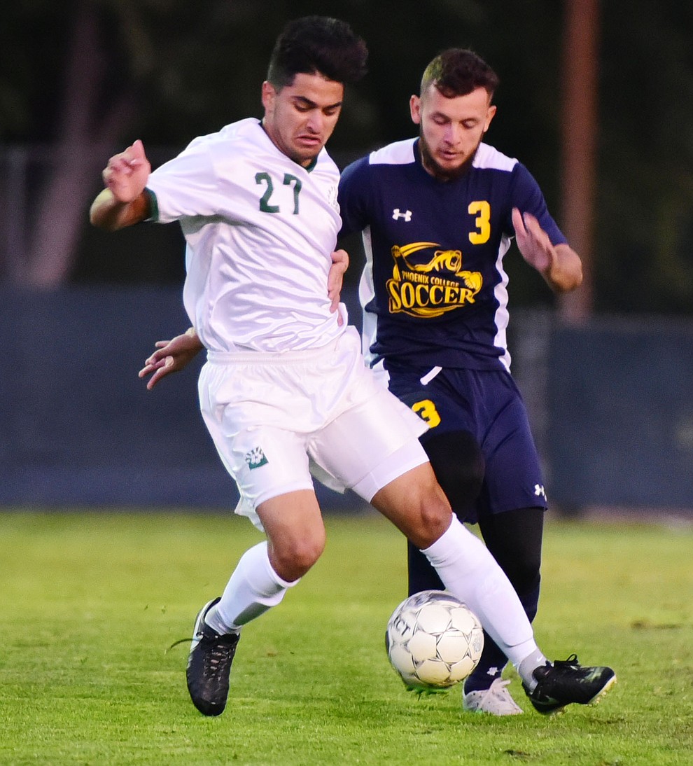 Yavapai's Ziyad Fares (27) battles with Jose Jimenez (3) as the Roughriders host Phoenix College in a soccer matchup Thursday, October 6, 2017 in Prescott. (Les Stukenberg/The Daily Courier Photo)