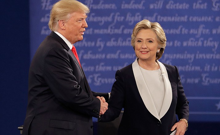 Republican presidential nominee Donald Trump shakes hands with Democratic presidential nominee Hillary Clinton during the second presidential debate at Washington University in St. Louis, Sunday, Oct. 9.