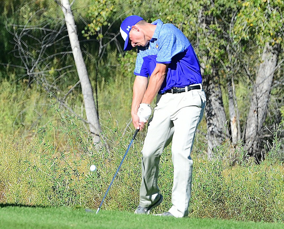 Prescott's Chase Kasun hits an approach shot in a match against Bradshaw Mountain, Mingus Union and Mohave Academy High Schools Tuesday, October 11, 2017 at Prescott Golf and Country Club. (Les Stukenberg/The Daily Courier)