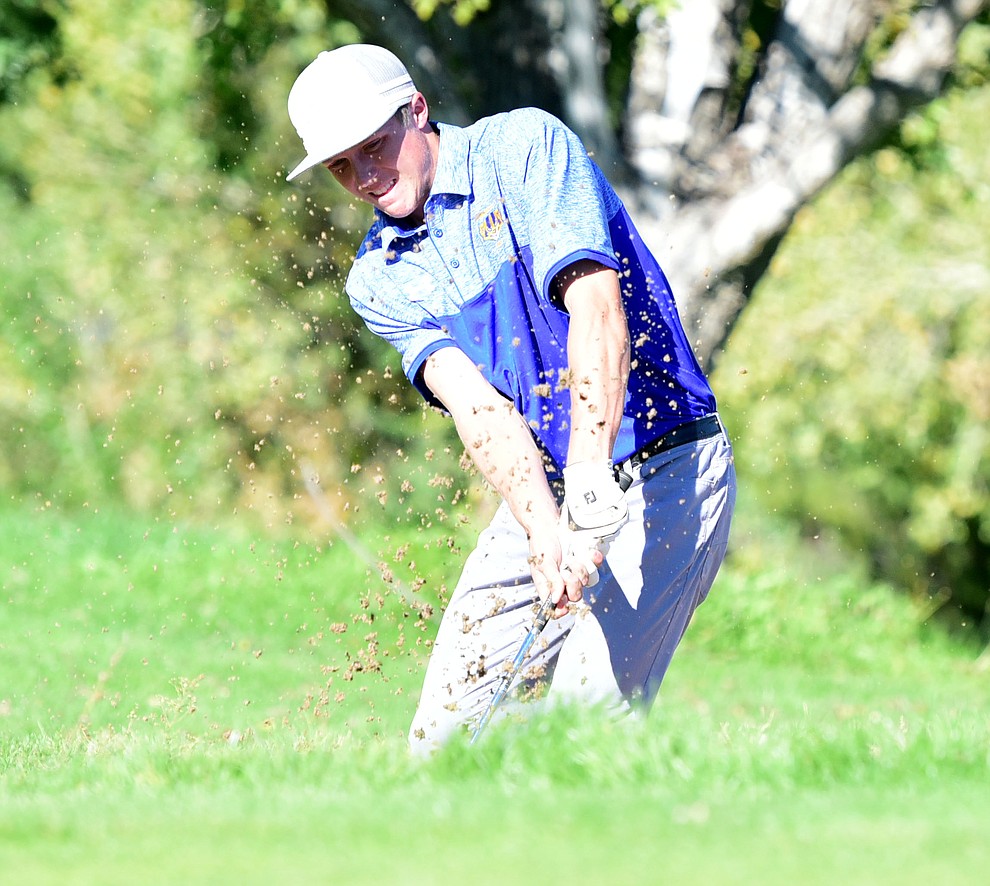 Prescott's Joey Christopherson hits from a bunker in a match against Bradshaw Mountain, Mingus Union and Mohave Academy High Schools Tuesday, October 11, 2017 at Prescott Golf and Country Club. (Les Stukenberg/The Daily Courier)