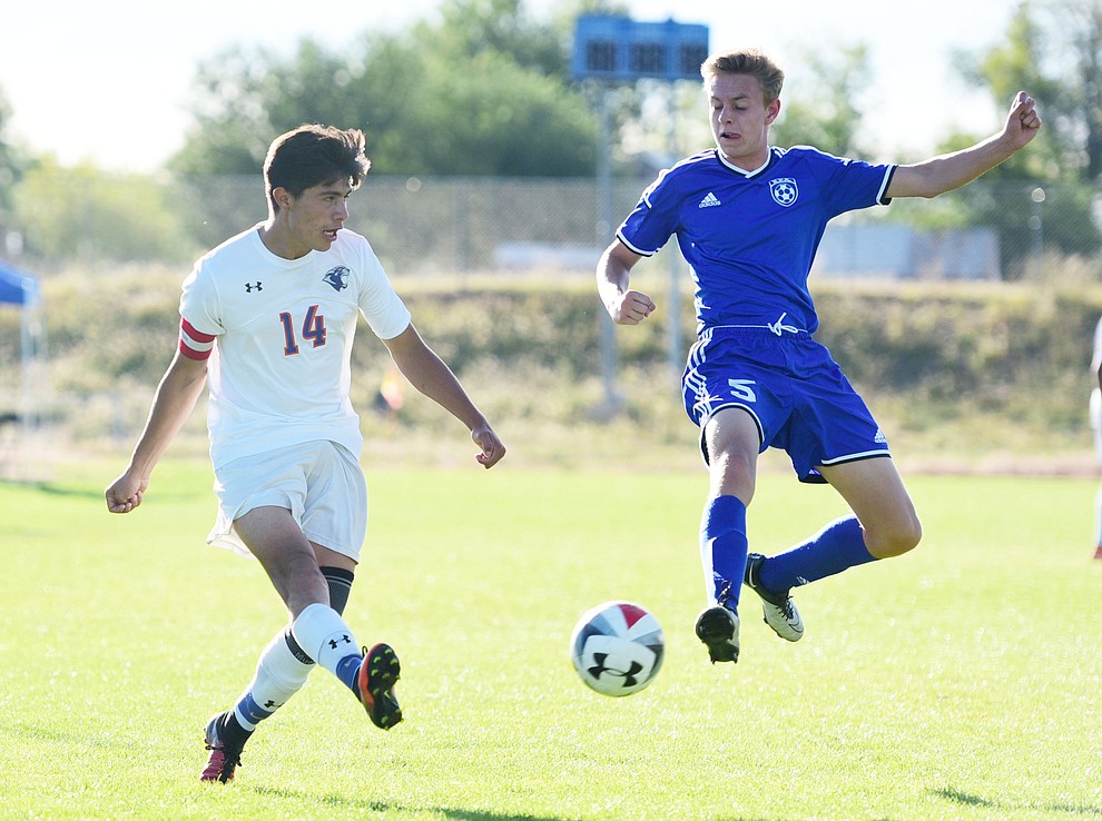 Chino Valley's Arturo Gomez (14) sends a centering pass as the Cougars take on Northland Prep Academy in Chino Valley Thursday, October 13. (Les Stukenberg/The Daily Courier)