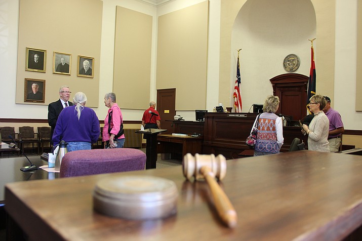 Visitors meander through one of the Yavapai County Courthouse courtrooms during the building’s 100-year anniversary celebration on Saturday, Oct. 15.