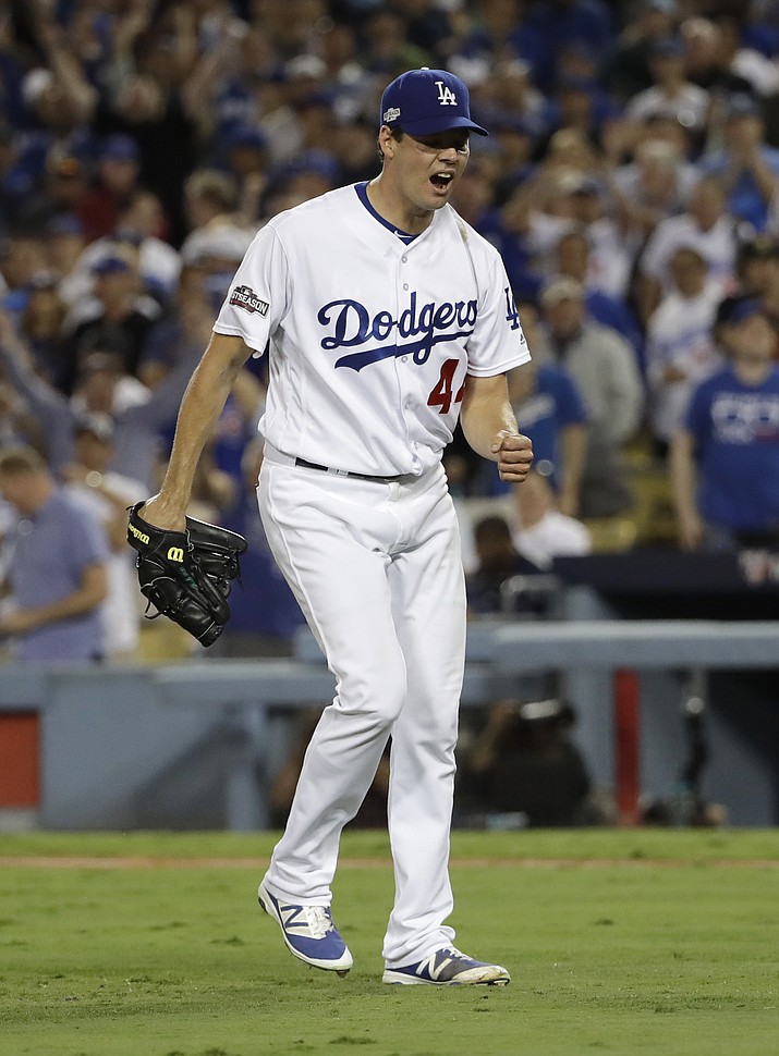 Los Angeles Dodgers starting pitcher Rich Hill reacts after striking out Chicago Cubs’ Anthony Rizzo in the sixth inning Tuesday in Los Angeles.