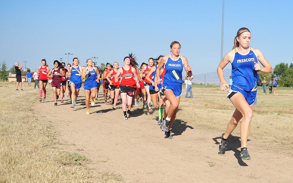 Prescott's Makennah Mills leads the field at the start during the Yavapai County Cross Country meet at Embry Riddle Aeronautical University in Prescott Wednesday, October 19.