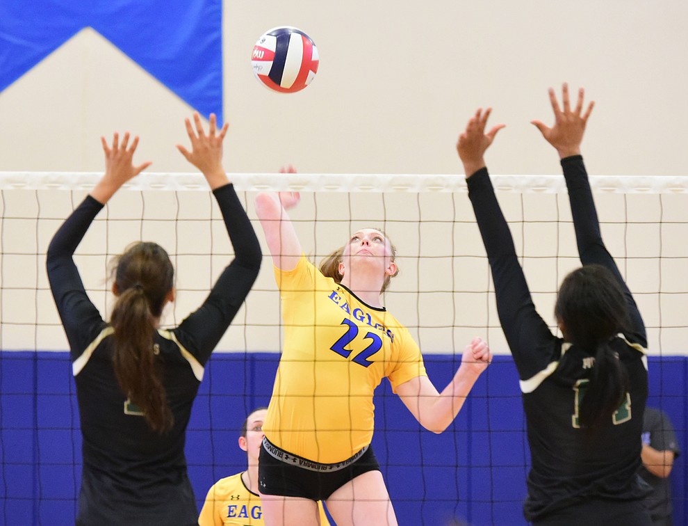 Embry Riddle's Lyndsey Weiler (22) sends a hard kill as the Lady Eagles take on Pacific Union College Friday afternoon in Prescott.