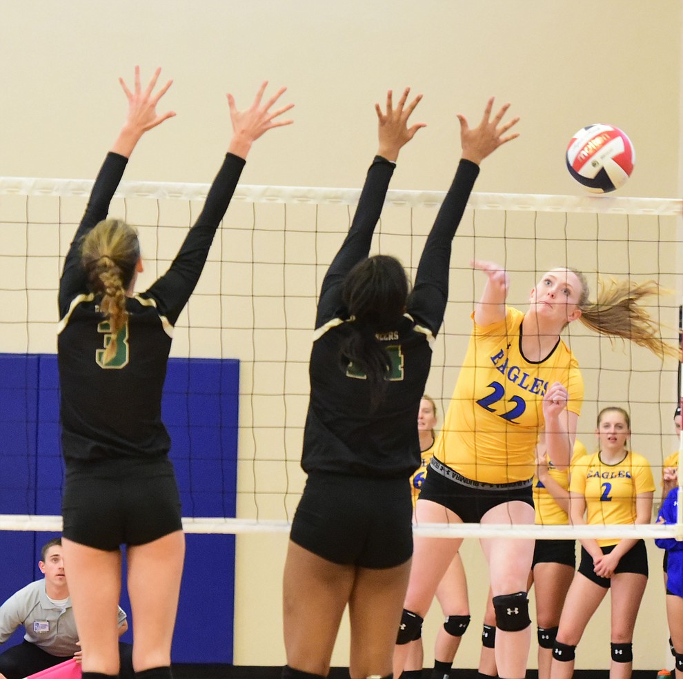 Embry Riddle's Lyndsey Weiler (22) sends a kill down the line as the Lady Eagles take on Pacific Union College Friday afternoon in Prescott.