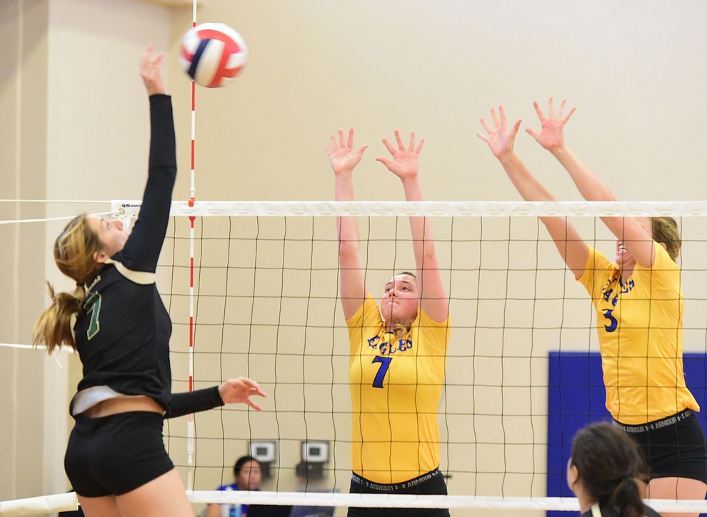 Embry Riddle's Hannah Mercurio (7) and Leah De Laurell (3) go for a block as the Lady Eagles take on Pacific Union College Friday afternoon in Prescott.