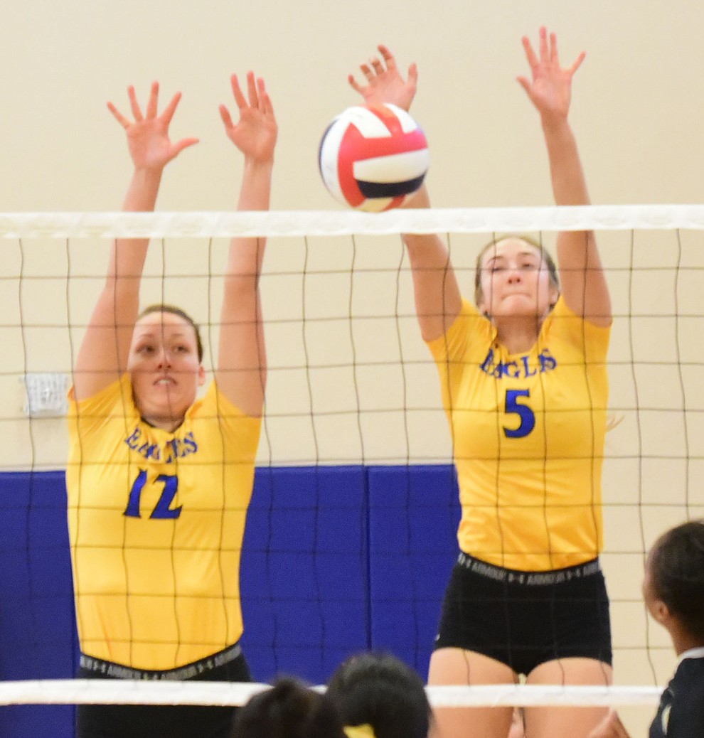 Embry Riddle's Katie Powell (12) and Jordan Jones (5) make a block as the Lady Eagles take on Pacific Union College Friday afternoon in Prescott.