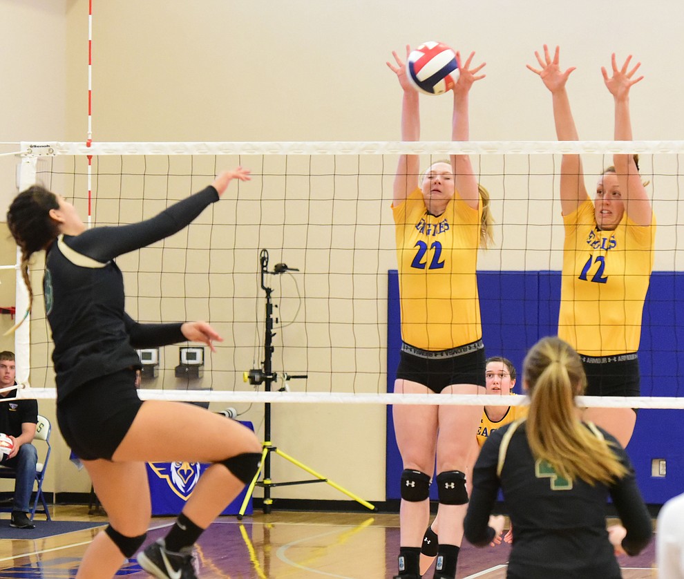 Embry Riddle's Lyndsey Weiler (22) and Katie Powell (12) make a block as the Lady Eagles take on Pacific Union College Friday afternoon in Prescott.