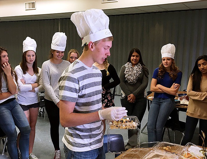 Prescott High School student Slater Smith presents to his peers how his team made their three-course meal during PHS’s Iron Chef Challenge on Wednesday, Oct. 19. 

