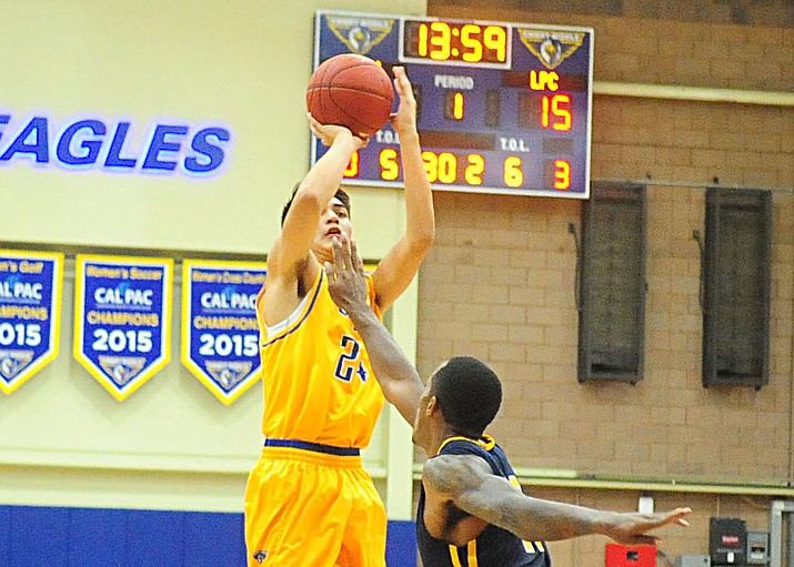 Embry Riddle's Gilbert Ibarra (24) takes a long range jump shot as the Eagles opened up their 2016-2017 season against Life Pacific College on Wednesday, Oct. 26, in Prescott. Ibarra scored 12 points, hitting four 3-pointers, but Embry-Riddle lost 82-76. (Les Stukenberg/The Daily Courier)
