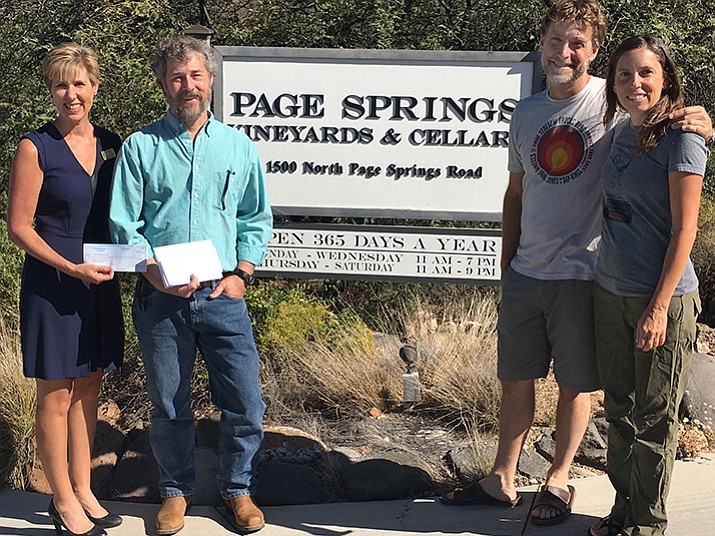 Big Brothers Big Sisters Verde Valley-Sedona Director Susan Turner, Prescott Creeks Executive Director Michael Byrd, and Eric and Gayle Glomski of Page Springs-End of the Tunnel Ventures were on hand for the Oct. 18 presentation ceremony at Page Springs Cellars. 