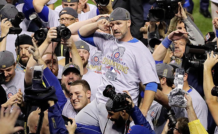 Chicago Cubs' David Ross is carried by teammates after Game 7 of the Major League Baseball World Series against the Cleveland Indians Thursday, Nov. 3, in Cleveland. The Cubs won 8-7 in 10 innings to win the series 4-3.