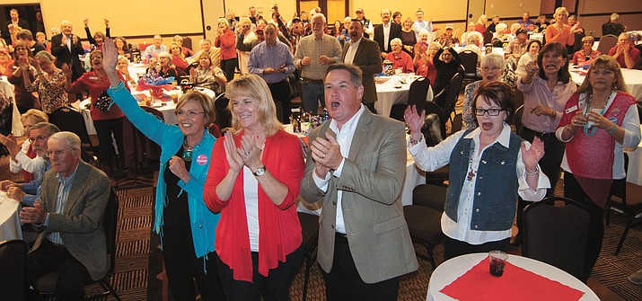 Billie Orr, Diane and Jack Smith and Pam Jones along with the rest of the room erupt in applause after early returns at the Republican Women of Prescott Victory Party at the Prescott Resort Tuesday, Nov. 8.