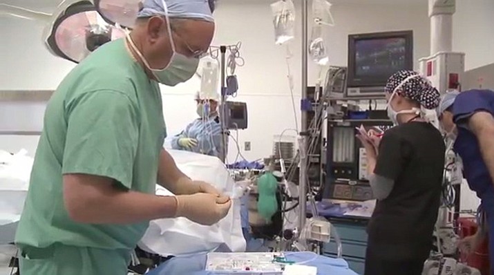 Doctors performing the transcatheter aortic valve replacement procedure.
