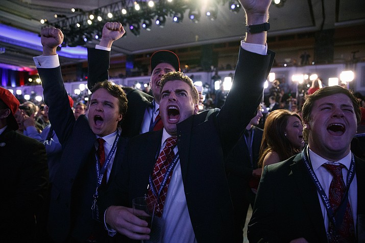 Supporters of Republican presidential candidate Donald Trump cheer as they watch election returns during an election night rally, Tuesday, Nov. 8, 2016, in New York. 