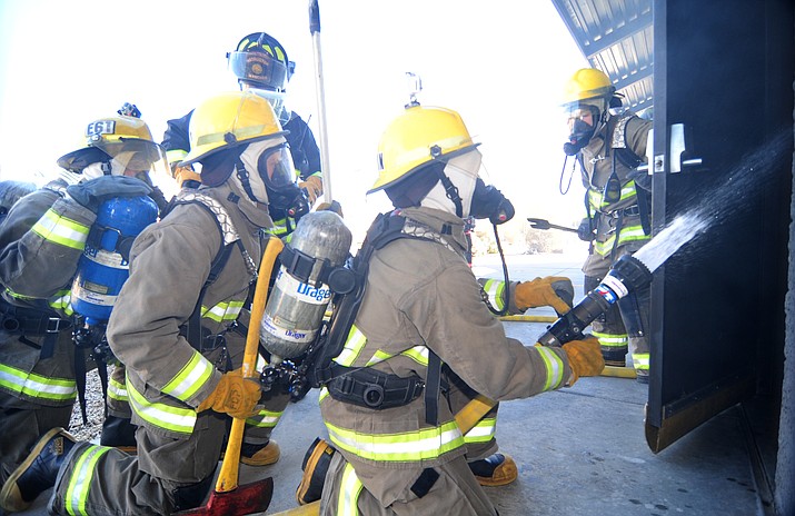 Students from the Yavapai College Fire Sciences program 1 and 2 used the Central Arizona Regional Training Academy for a live fire training class Saturday, Nov. 12.  (Les Stukenberg/The Daily Courier)