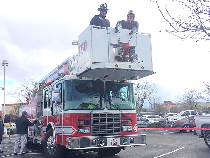 While wind prevented Prescott Valley Chamber of Commerce CEO Marnie Uhl from ascending 101 feet in the Central Arizona Fire & Medical Authority fire truck ladder, that didn’t stop her from at least getting in the bucket at the 13th Annual Flying High Turkey Drive on Monday, Nov. 21 at the Prescott Valley Fry’s. 